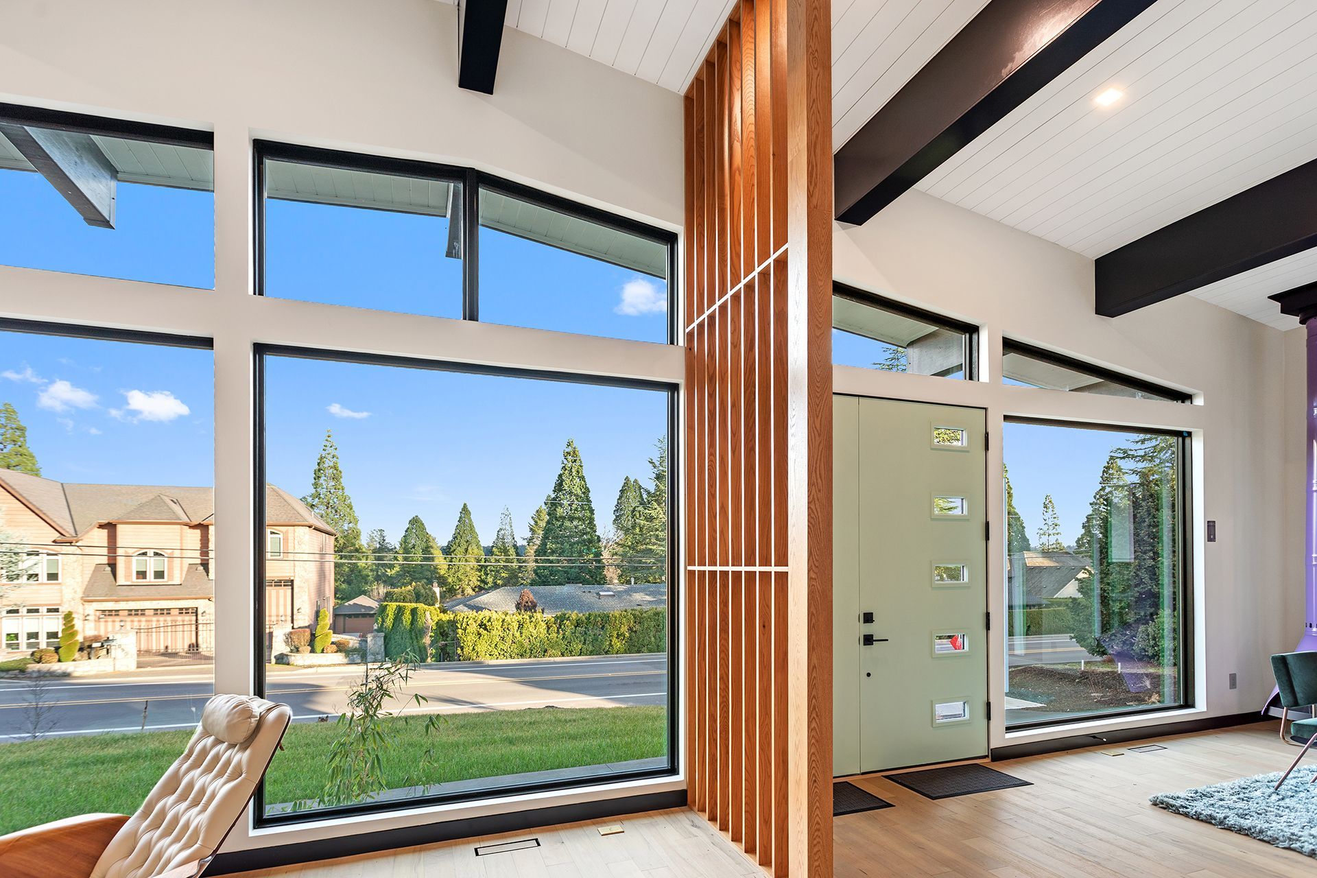A living room with a wood for a divider
