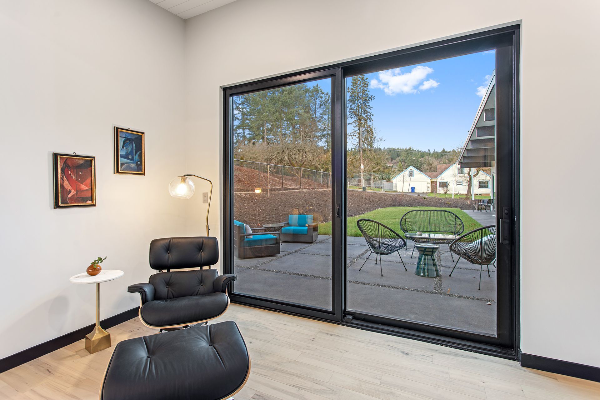 Chair beside a sliding glass door leading to a patio