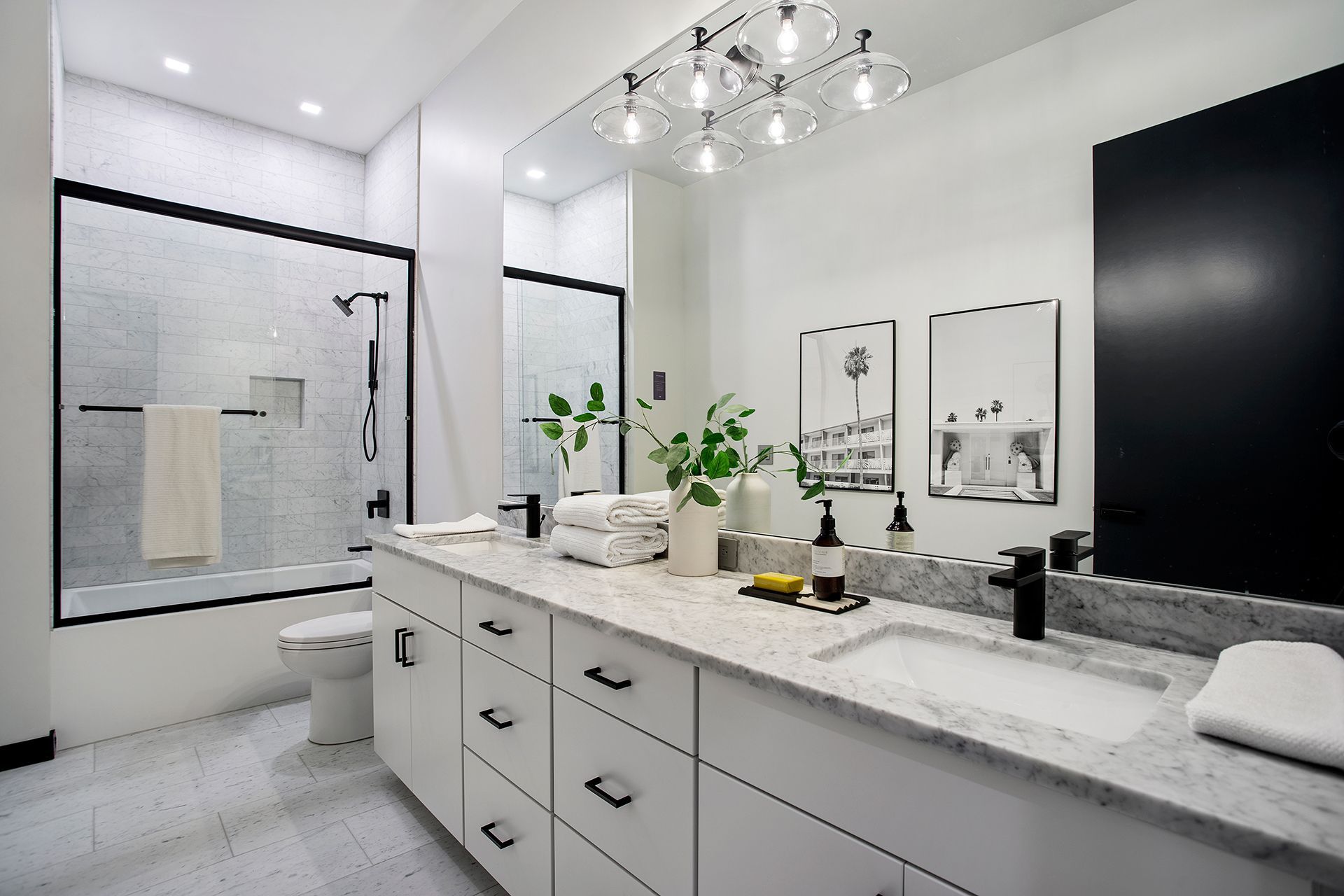 Bathroom with white walls and white cabinets