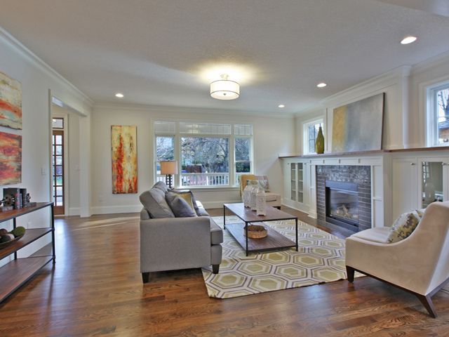 Clean living room with paintings on the walls