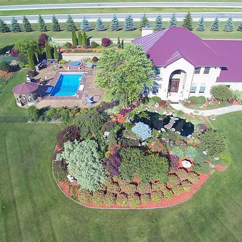 An aerial view of a house with a purple roof