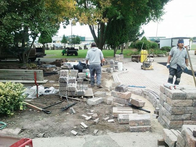 a group of men are working on a construction site