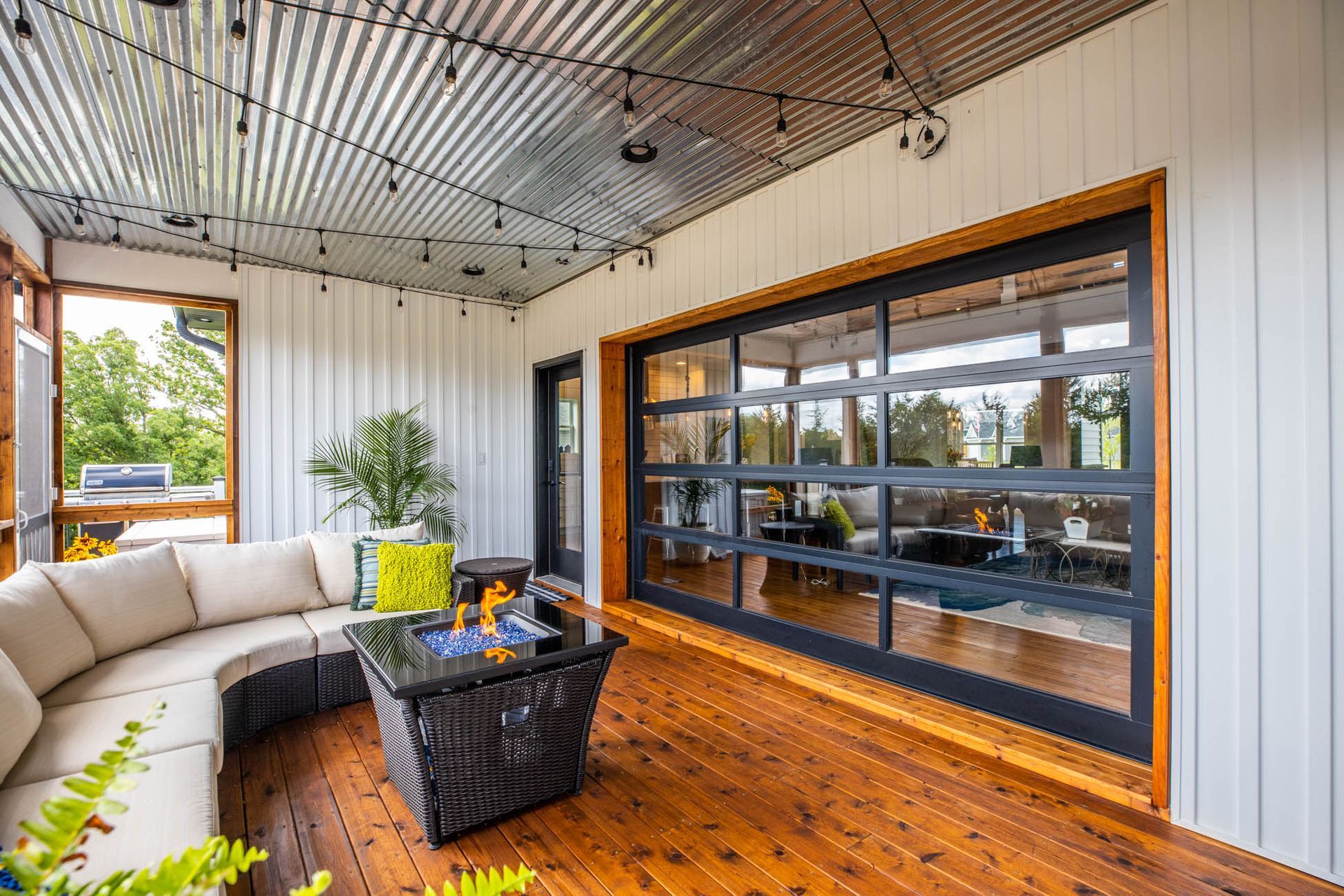 A living room with a couch, coffee table, and sliding glass doors