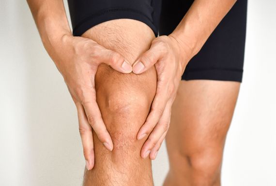 Man suffering from knee pain