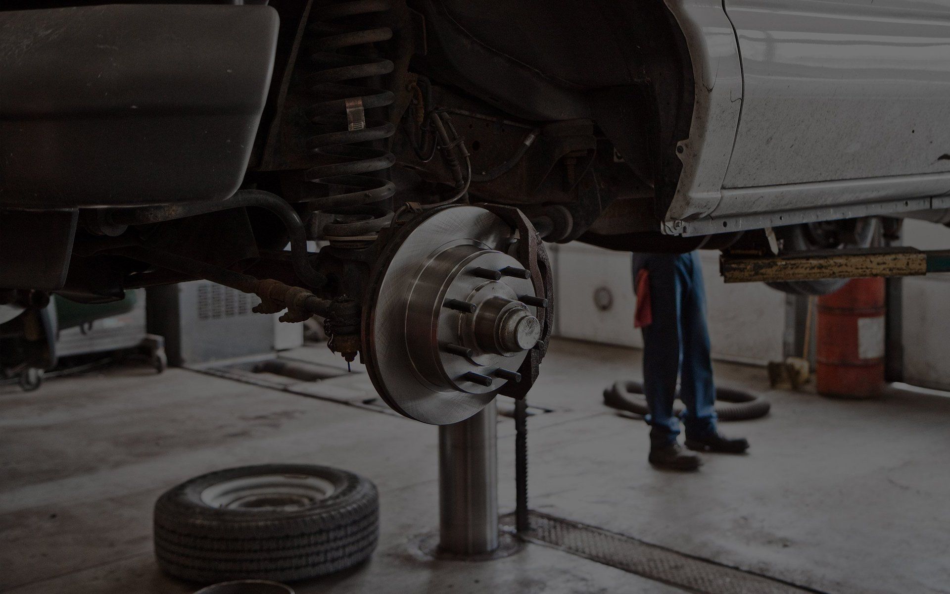 Brake rotor and suspension repair on the lift at Sacco's Auto Repair