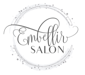 A black and white logo for a salon with a circle around it.