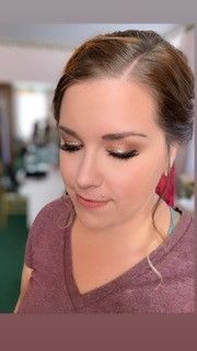 A close up of a woman 's face with makeup on.