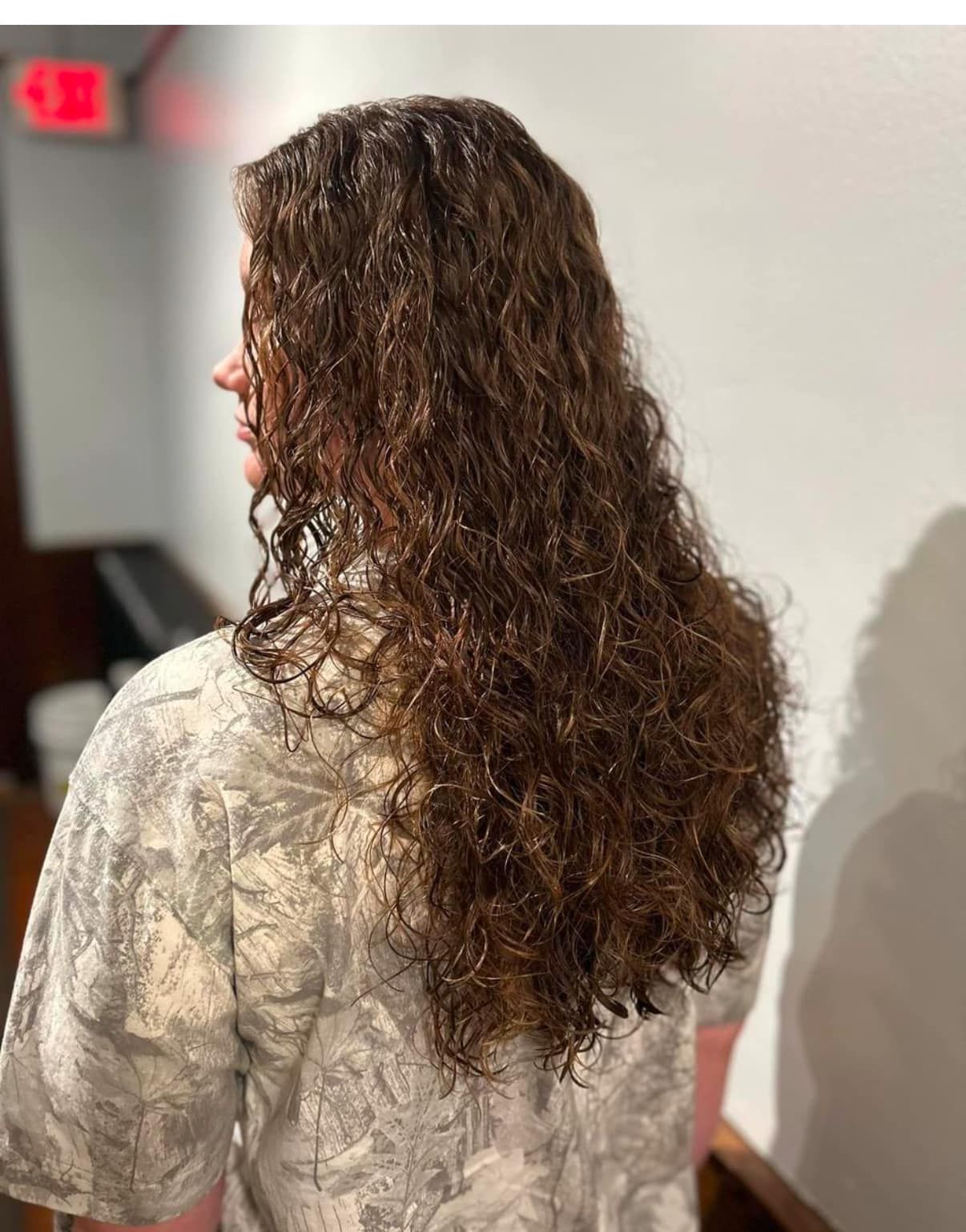 A woman with long curly hair