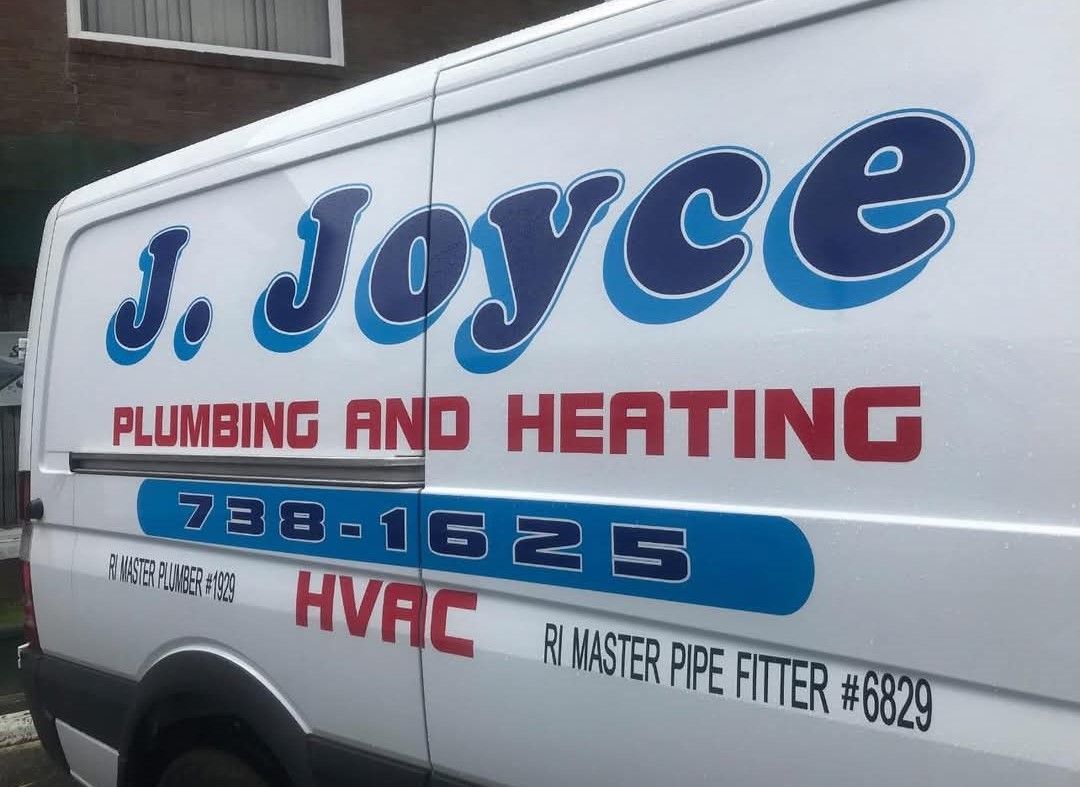 A white van that says j joyce plumbing and heating