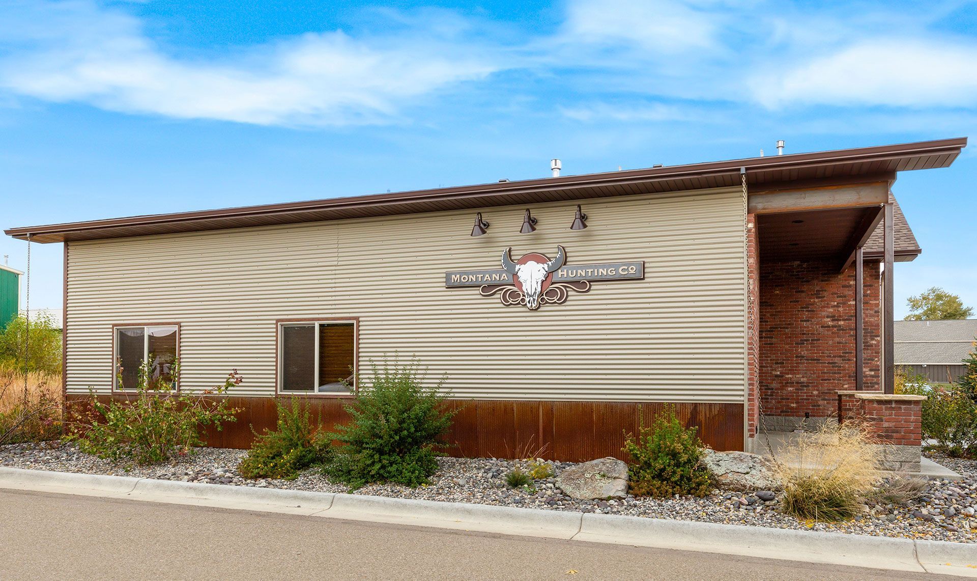 Monta Hunting Co sign within the siding wall