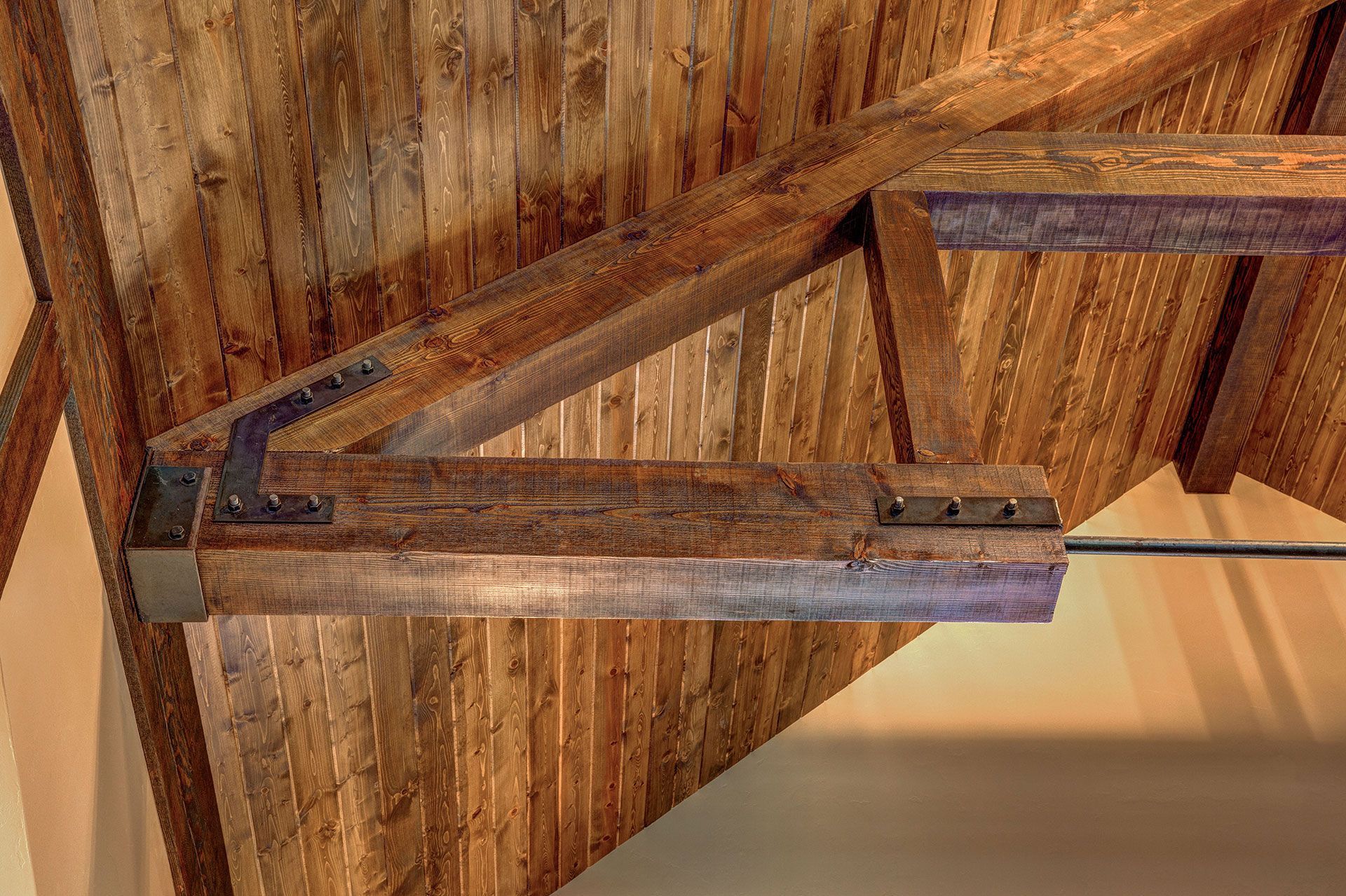 A room with a wooden ceiling and wooden beams
