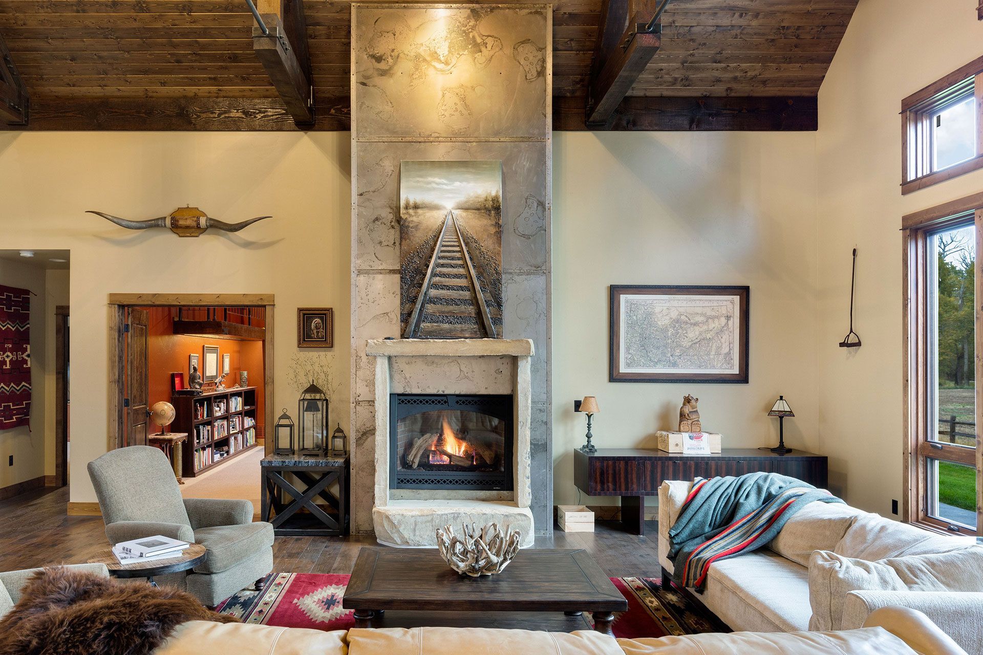 There is a fireplace in the middle of the living room