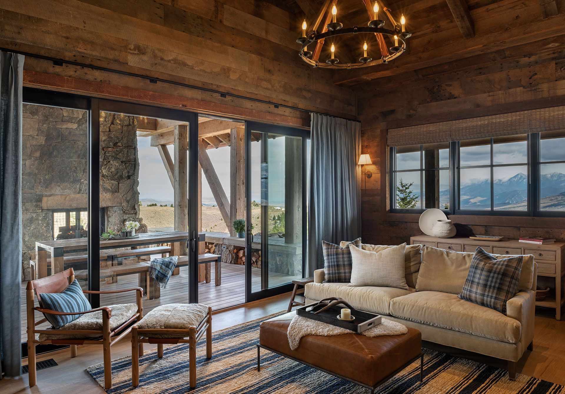 A living room with a couch, chairs, and a chandelier