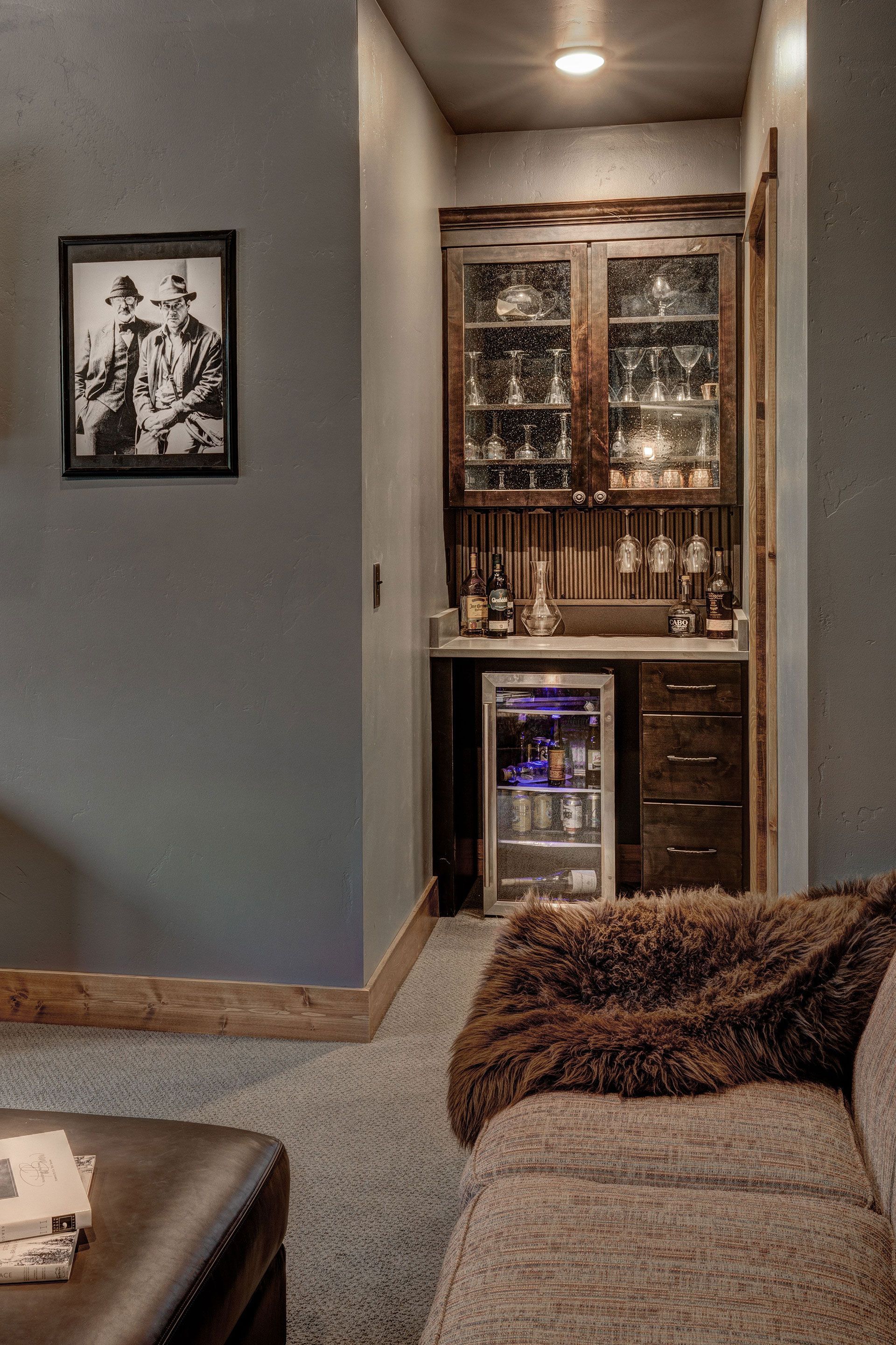 A living room with a bar and a couch