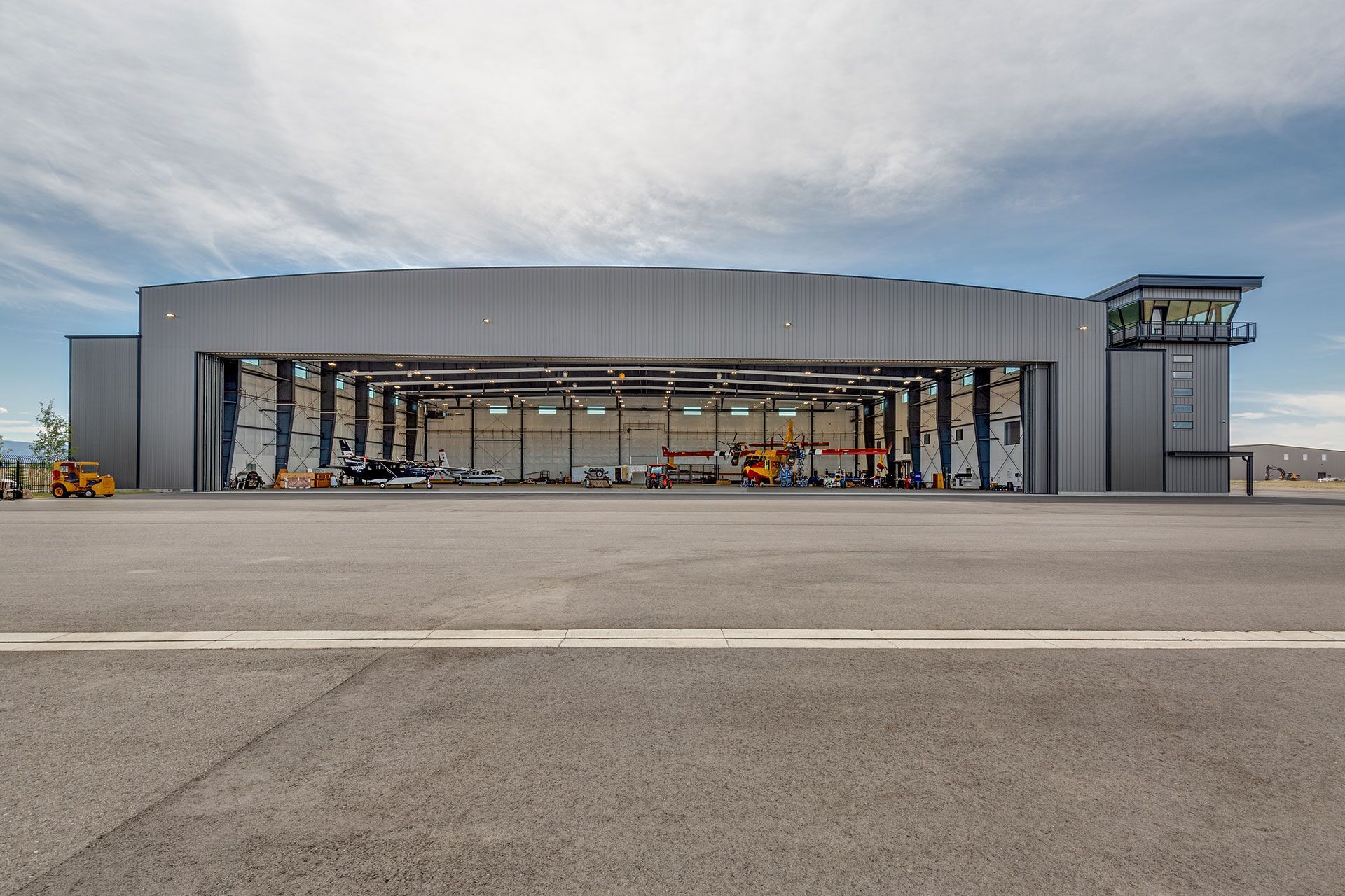 An airplane hangar with a large sliding door