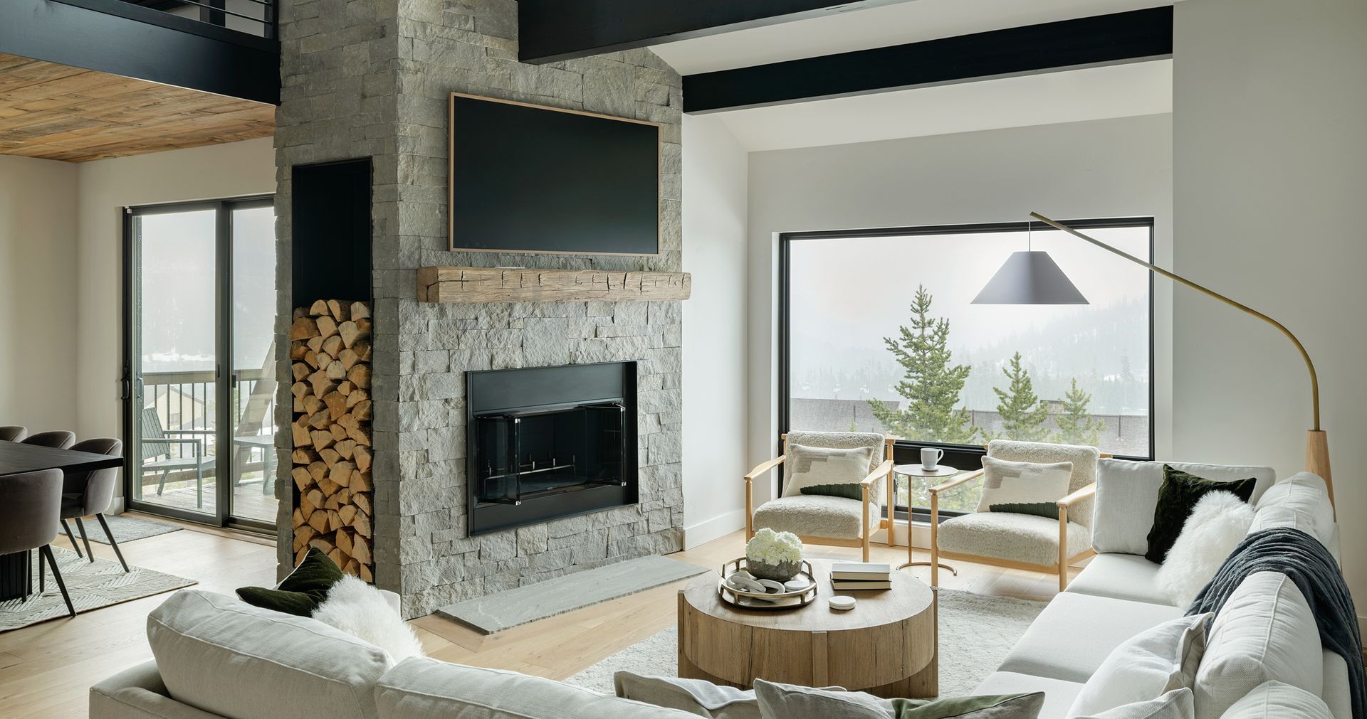 There is a fireplace in the middle of the living room.