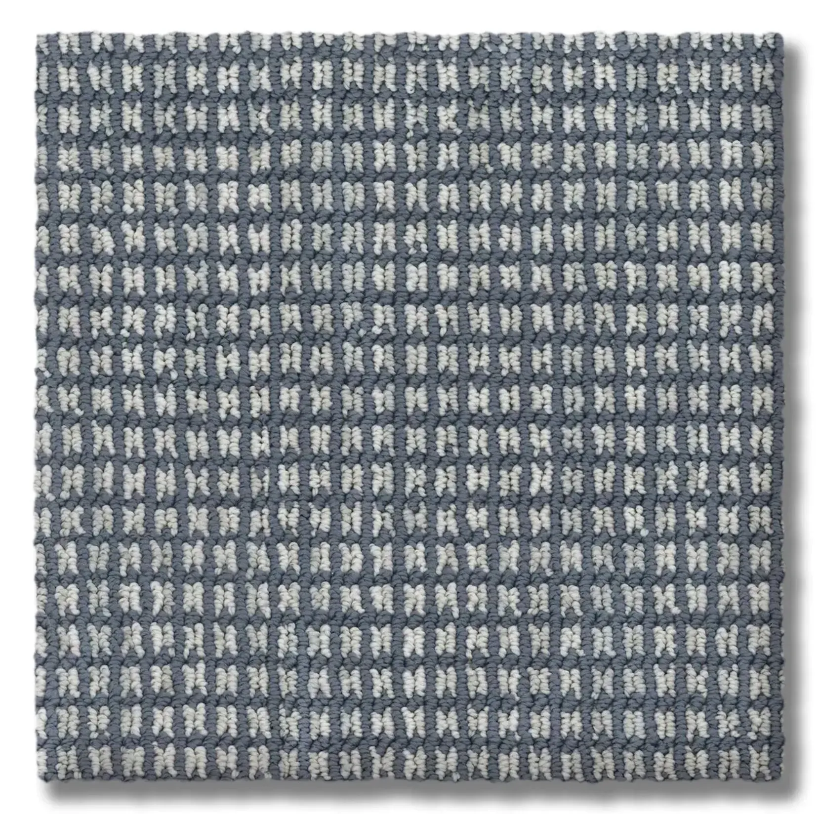 Square carpet tile in a grid pattern with a blue-gray background and white, vertical rectangular shapes.