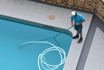 Man cleaning pool