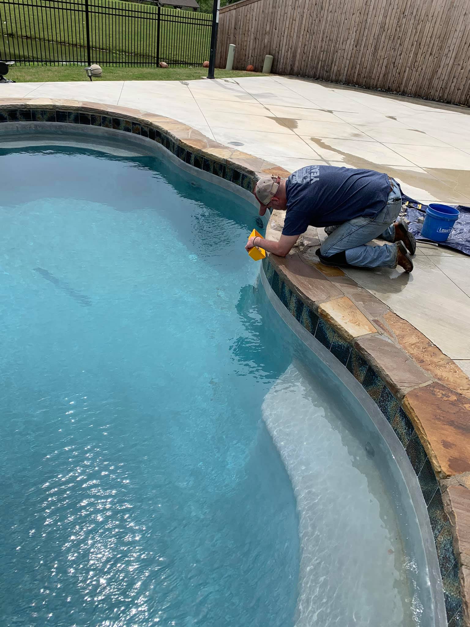 Man cleaning pool