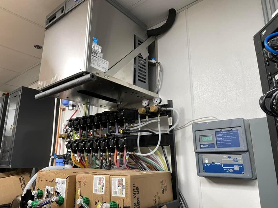 A room with a lot of electrical equipment on the wall.