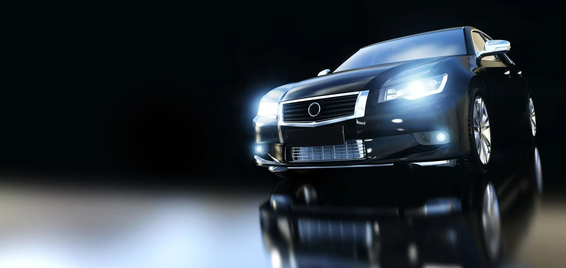 Glossy black SUV driving on a dark road with bright headlights and reflections on the wet surface