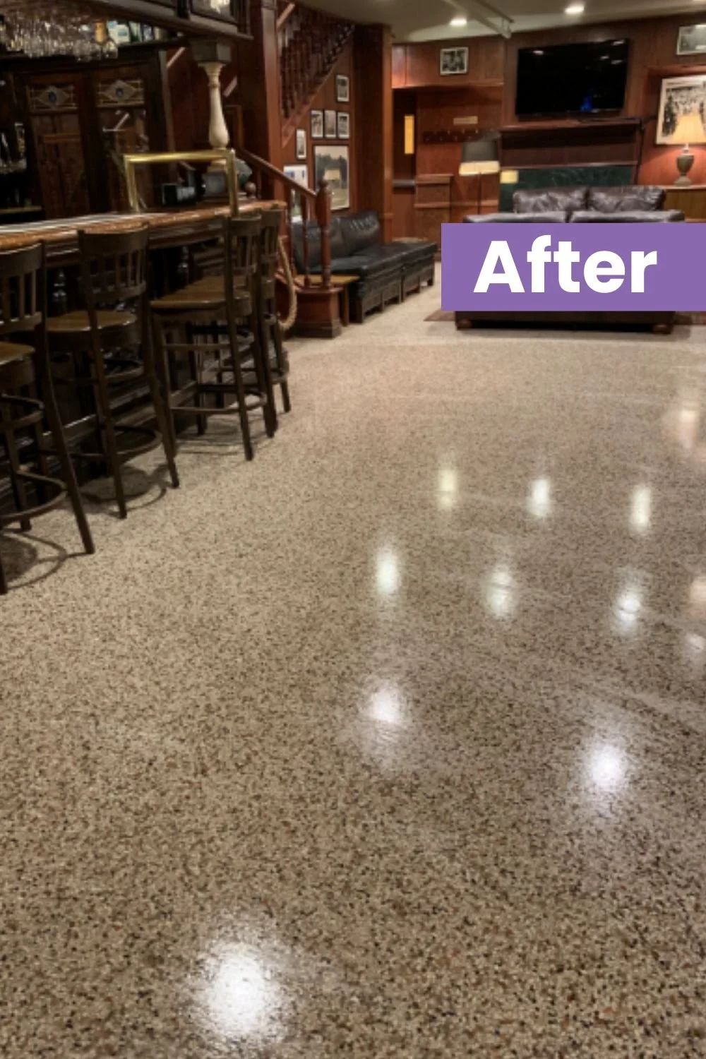 Polished speckled floor in a dim bar interior, with stools and wooden walls reflected in the shine.