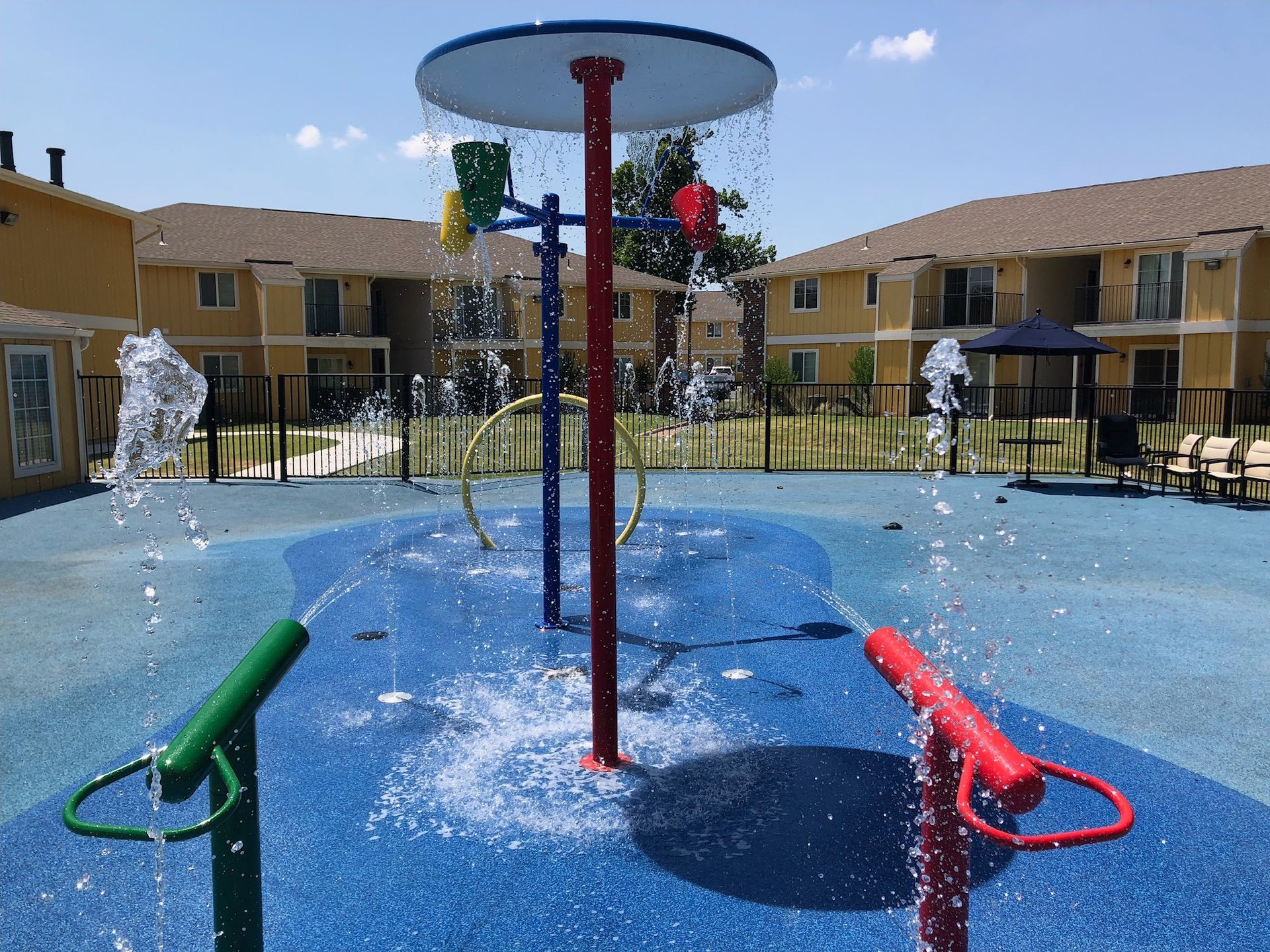 a colorful water fountain in front of a building
