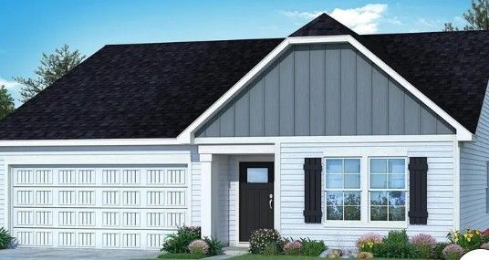 White house with black roof, gray accents, and a two-car garage.