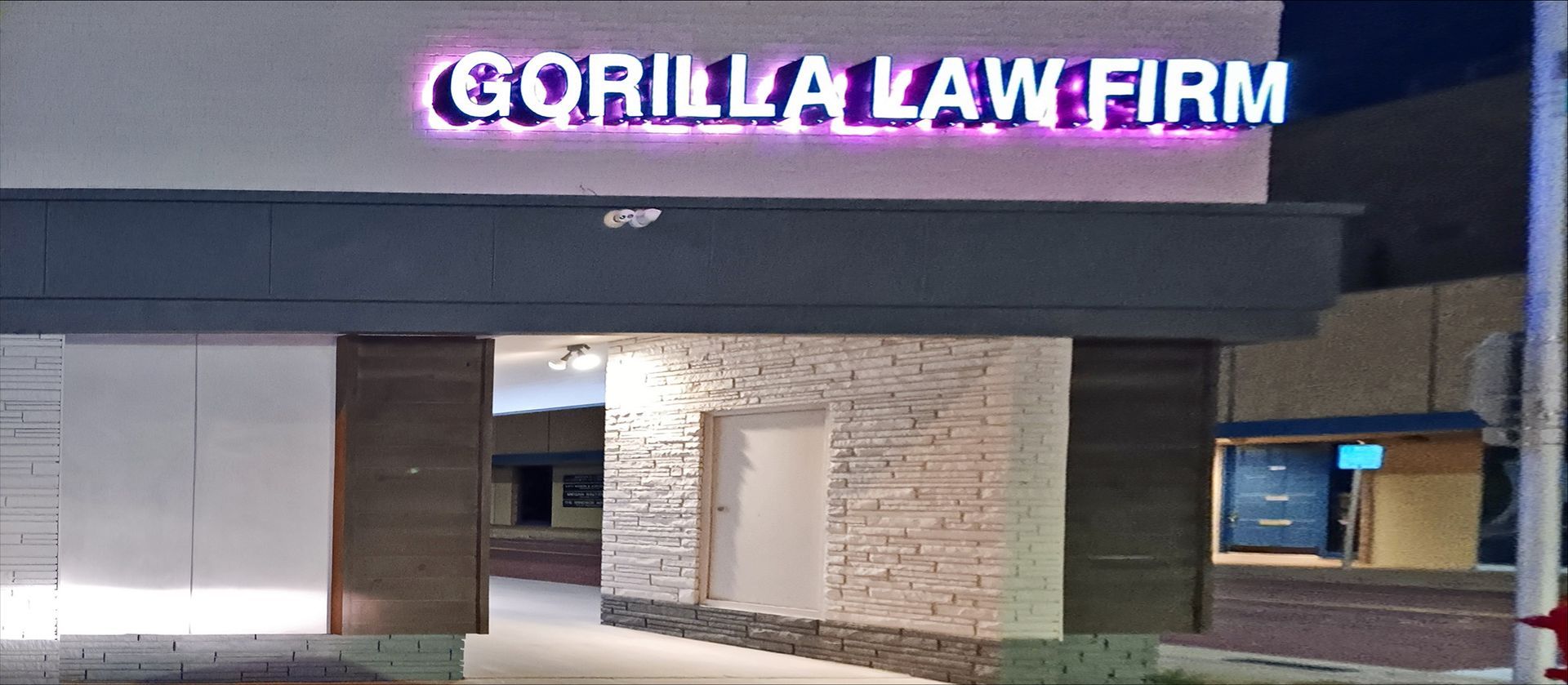 Gorilla Law Firm sign above building entrance. 