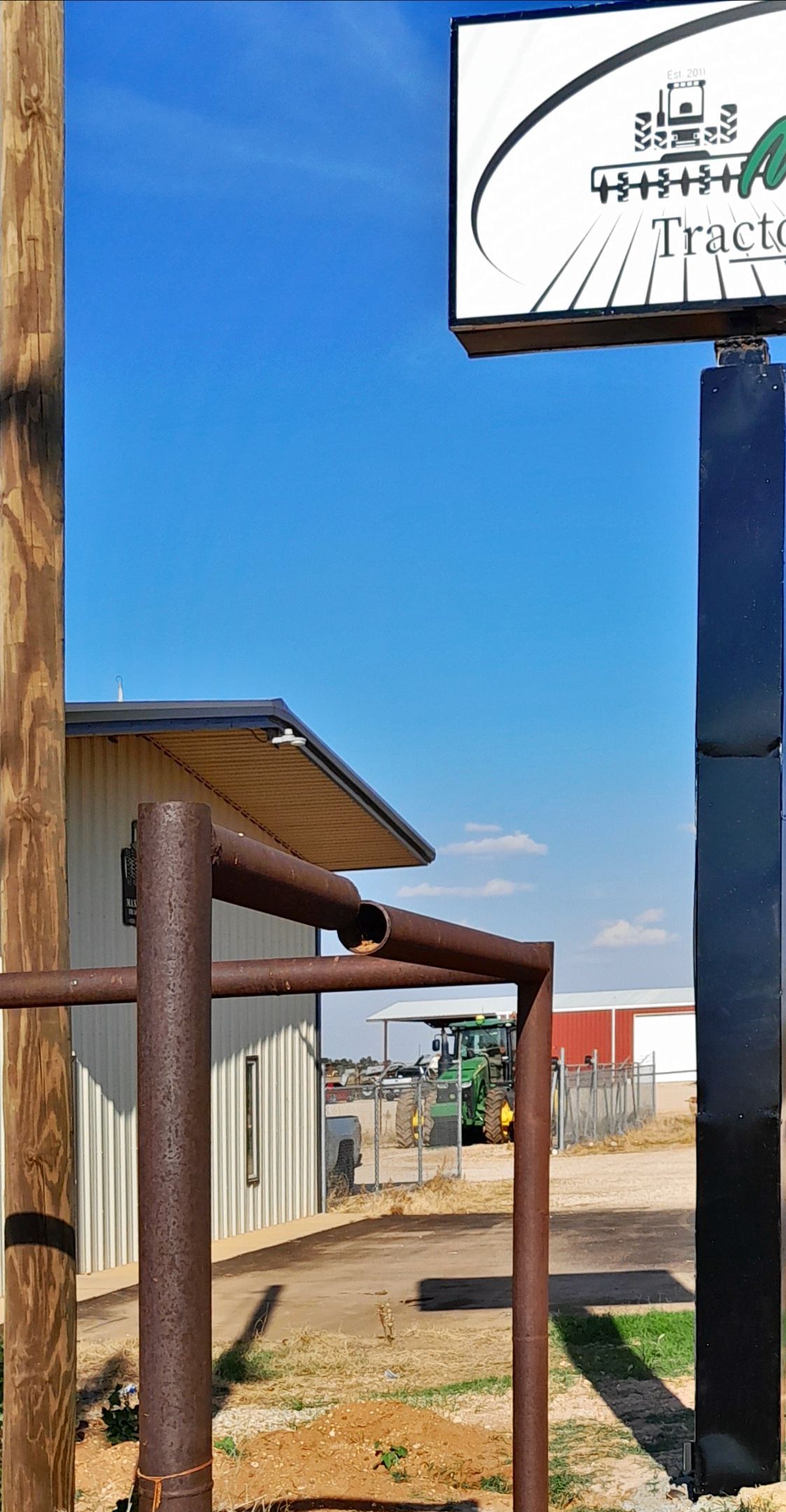 A sign with a tractor icon on it