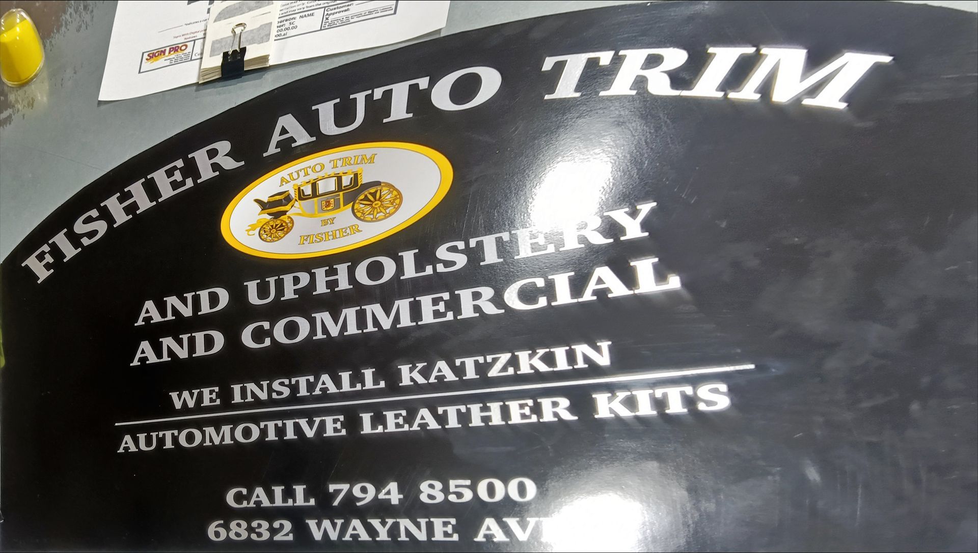 Black sign for Fisher Auto Trim