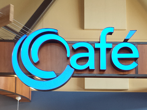 A blue sign that says cafe on it