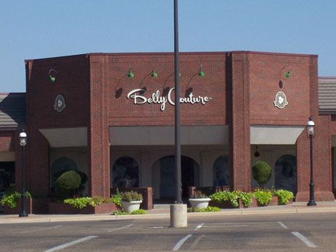 A brick building with belly couture written on it