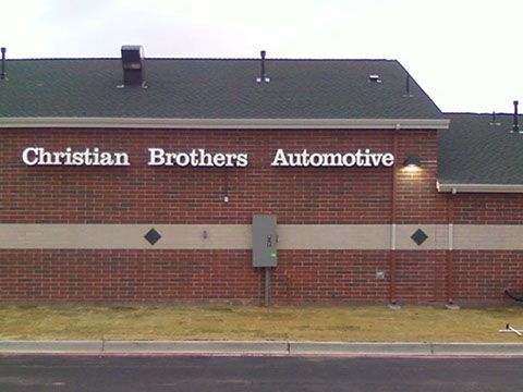 A brick building with a sign that says christian brothers automotive