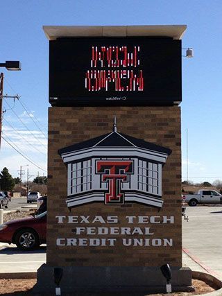 A sign for the texas tech federal credit union