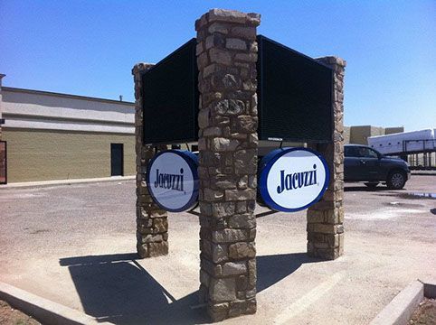 A jacuzzi sign that is outside of a building