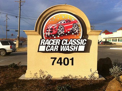 A sign that says racer classic car wash on it