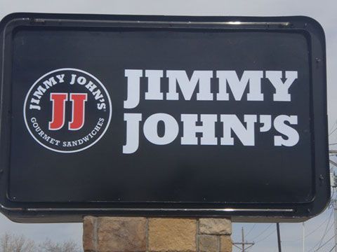 A sign for jimmy john's gourmet sandwiches