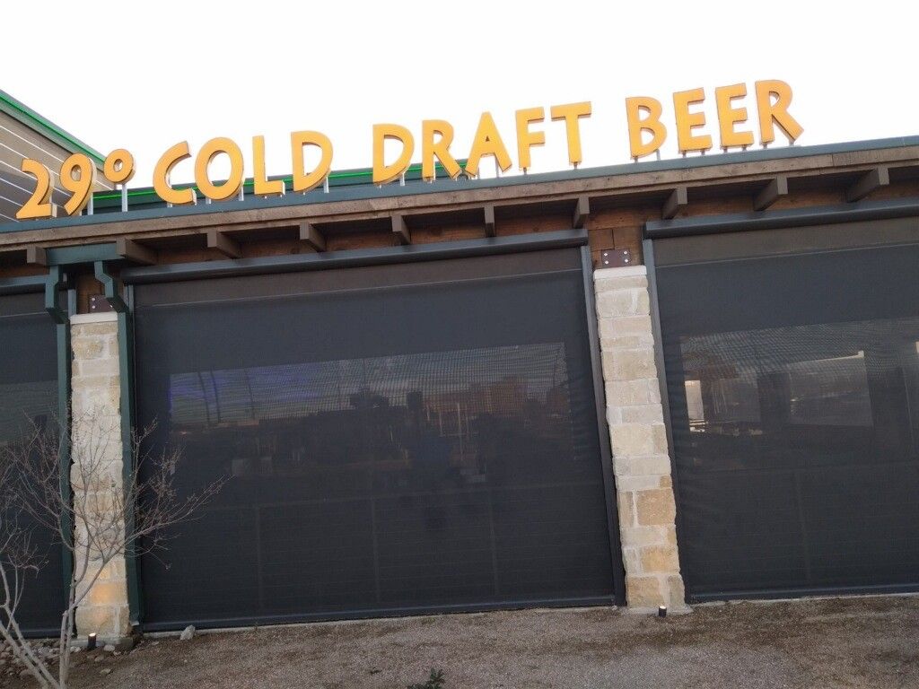 A building with a sign that says 29 degrees cold draft beer