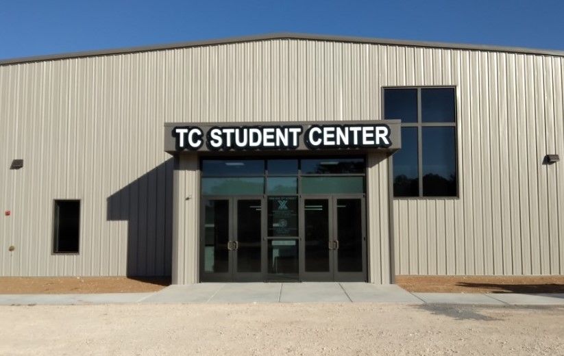 The front of a building that says tc student center