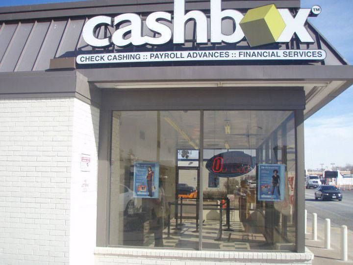 A cashbox store with a sign that says check cashing payroll advances and financial services