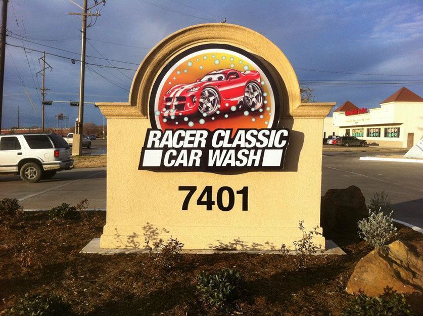 A sign that says racer classic car wash on it