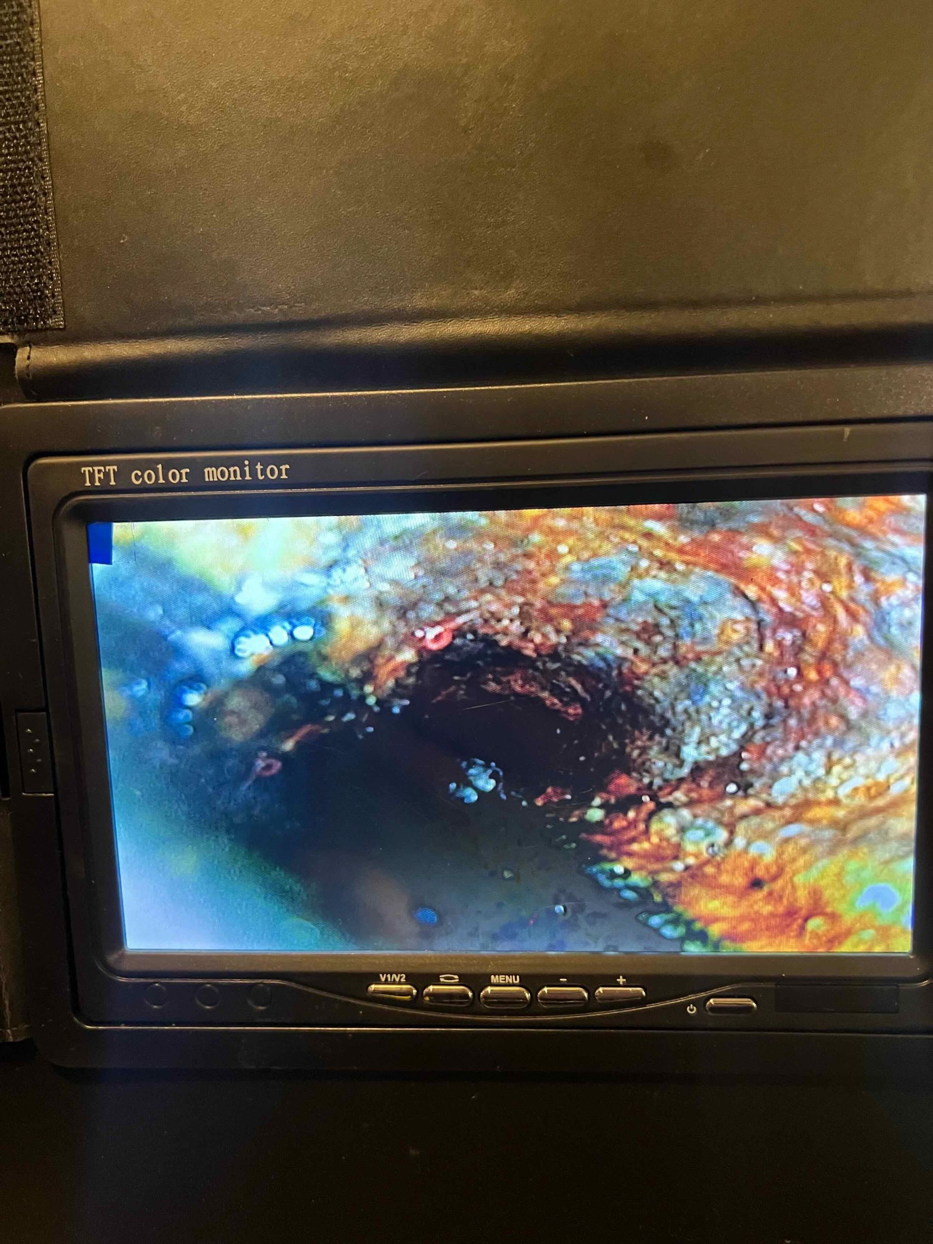 A close up of a tv screen with a picture of a pipe on it.