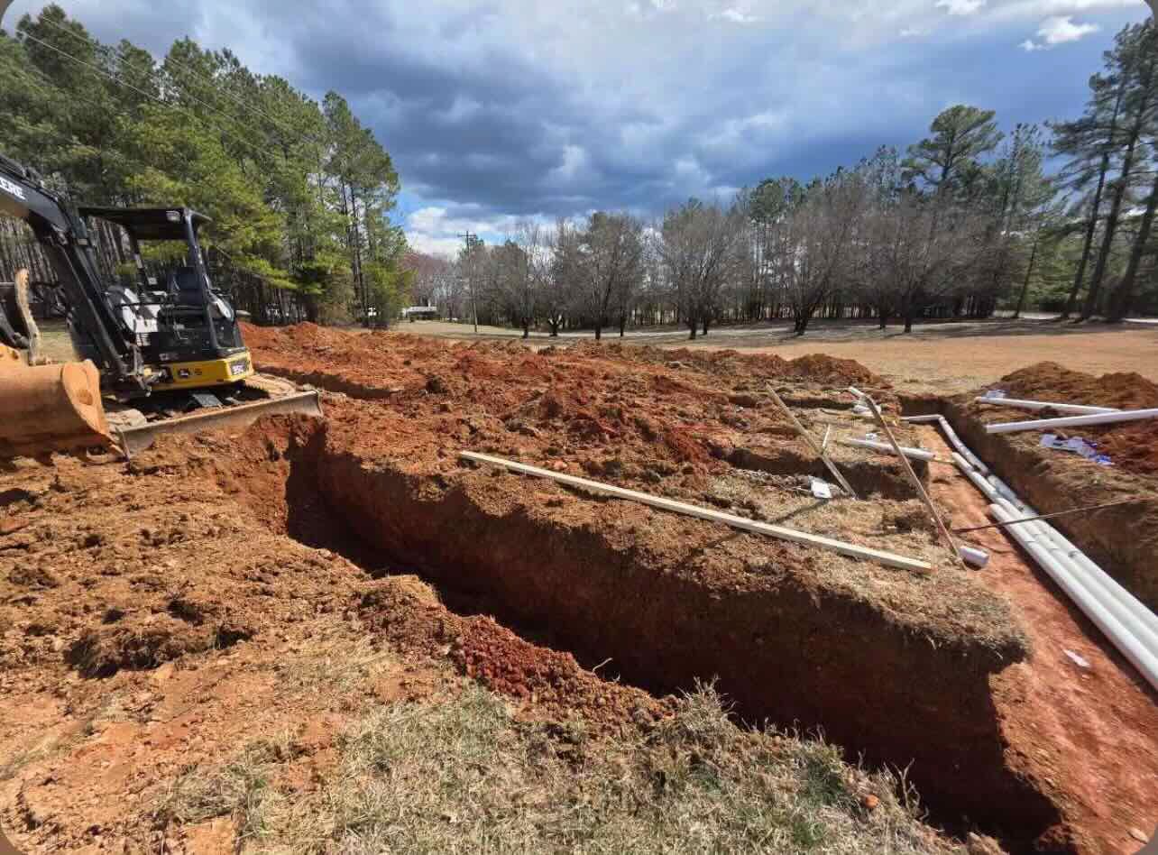 A bulldozer is digging a hole in the ground.