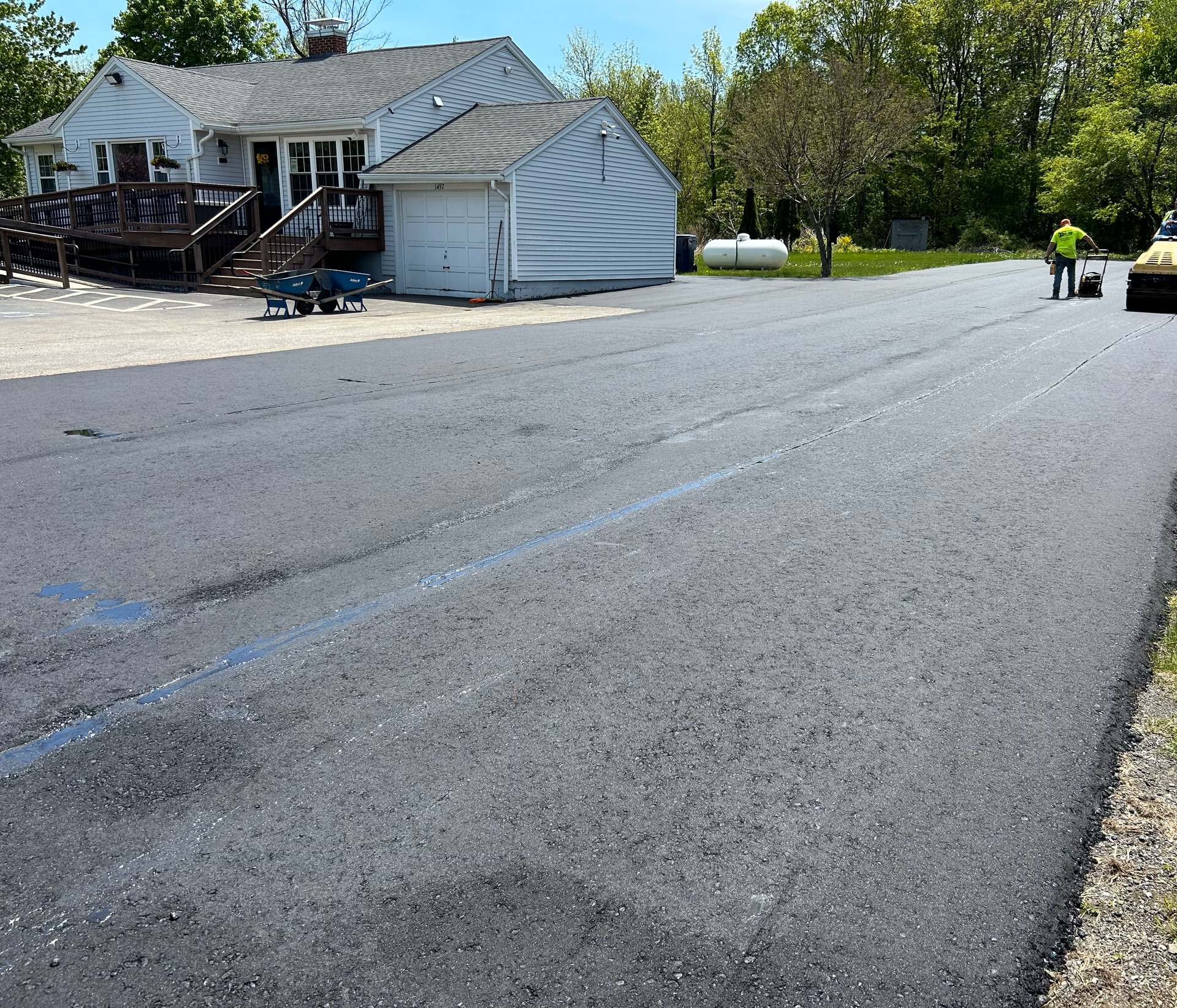 A house is being built on the side of a road
