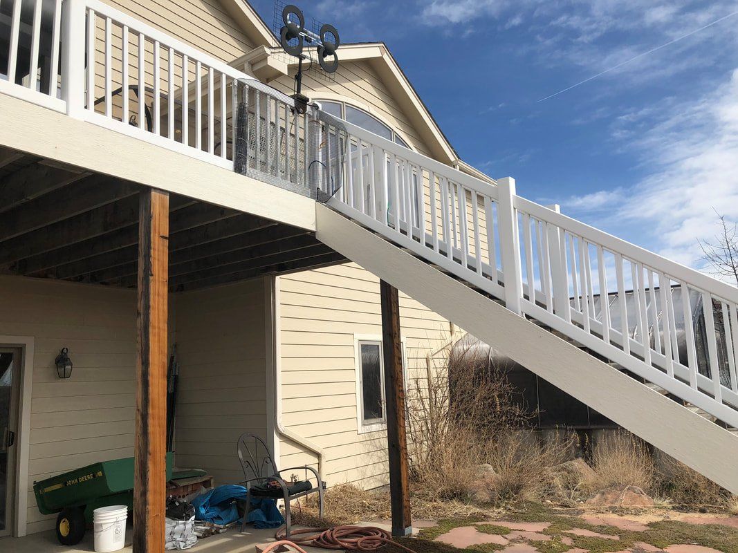 Custom raised deck and stairs covered patio