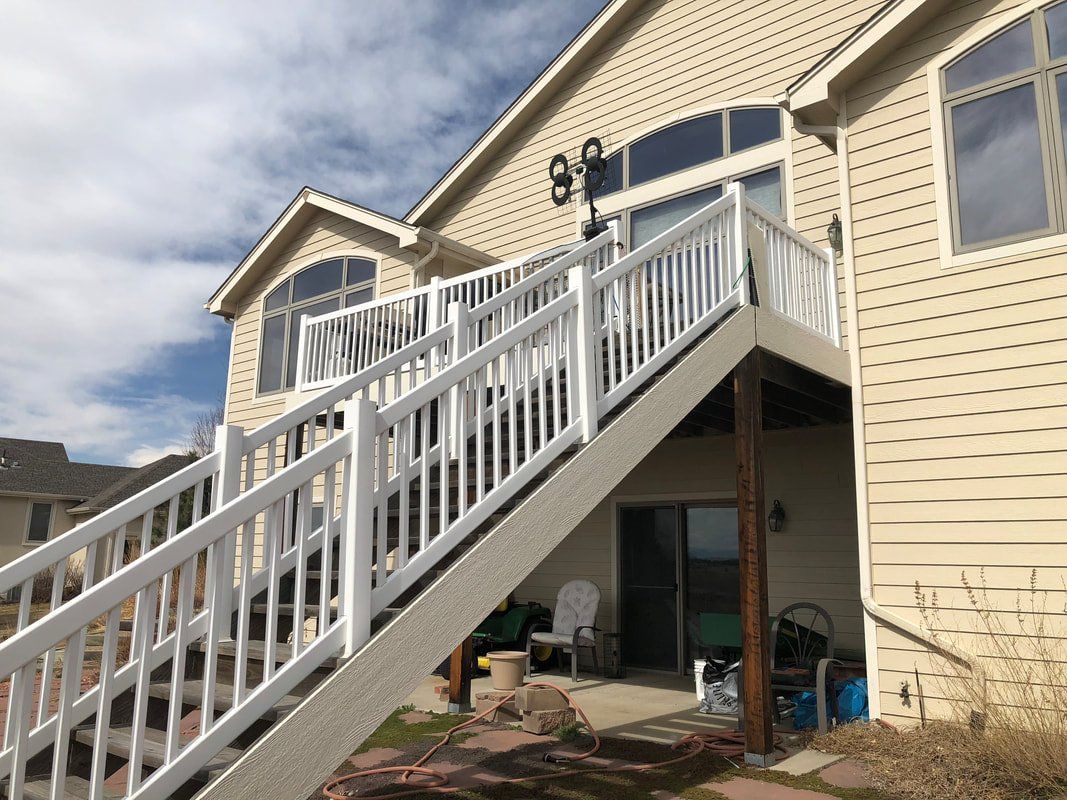 Custom raised deck and stairs covered patio