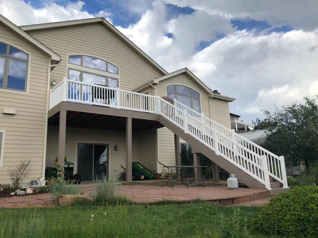Custom raised deck and stairs covered patio