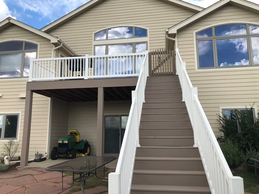 Custom raised deck and stairs covered patio