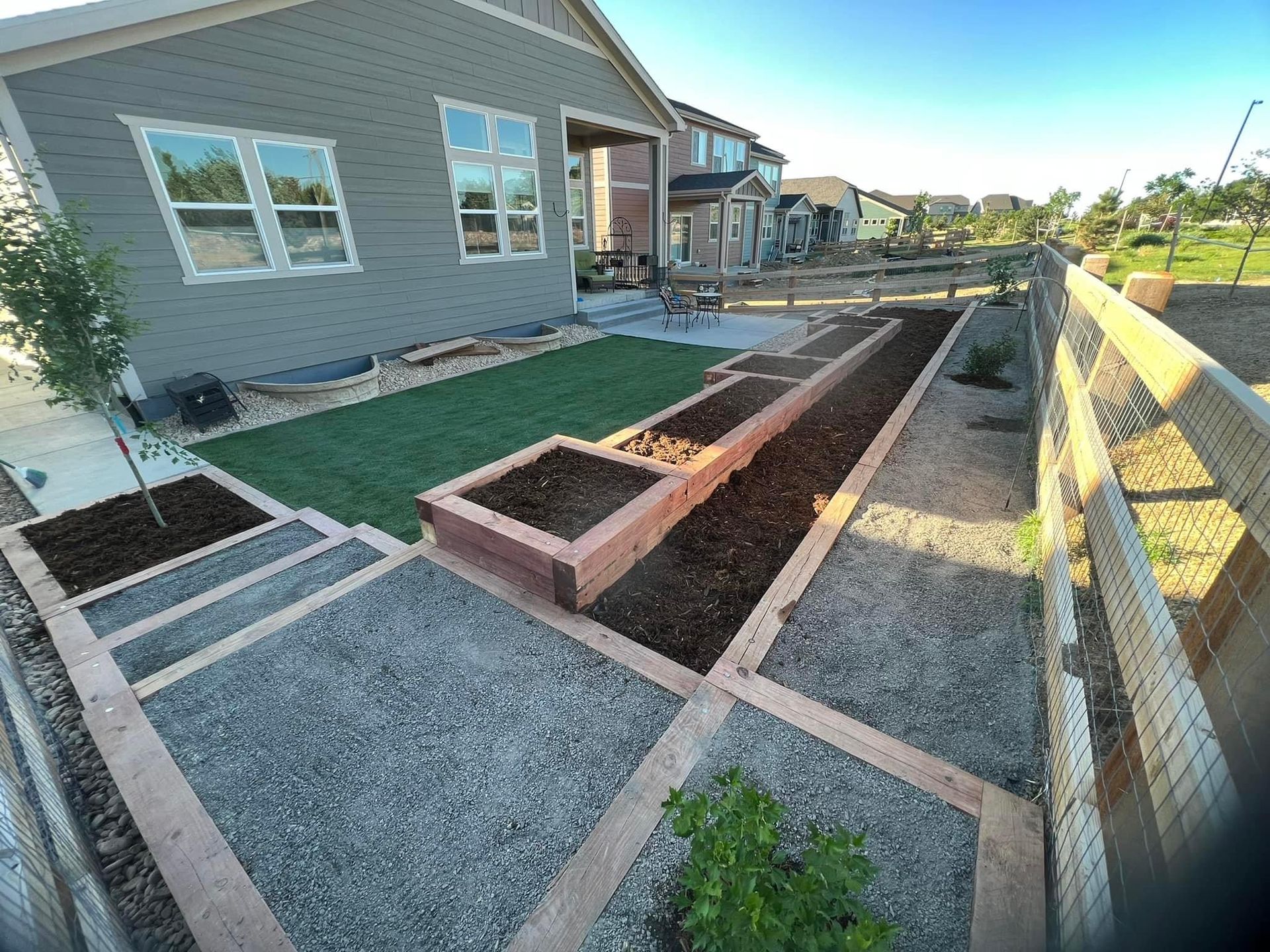 Artistic Escapes  low profile contemporary wood garden raised bed planter boxes, creating a frame for the organic art created through plants EATON COLORADO landscape design landscape installation garden bed raised garden